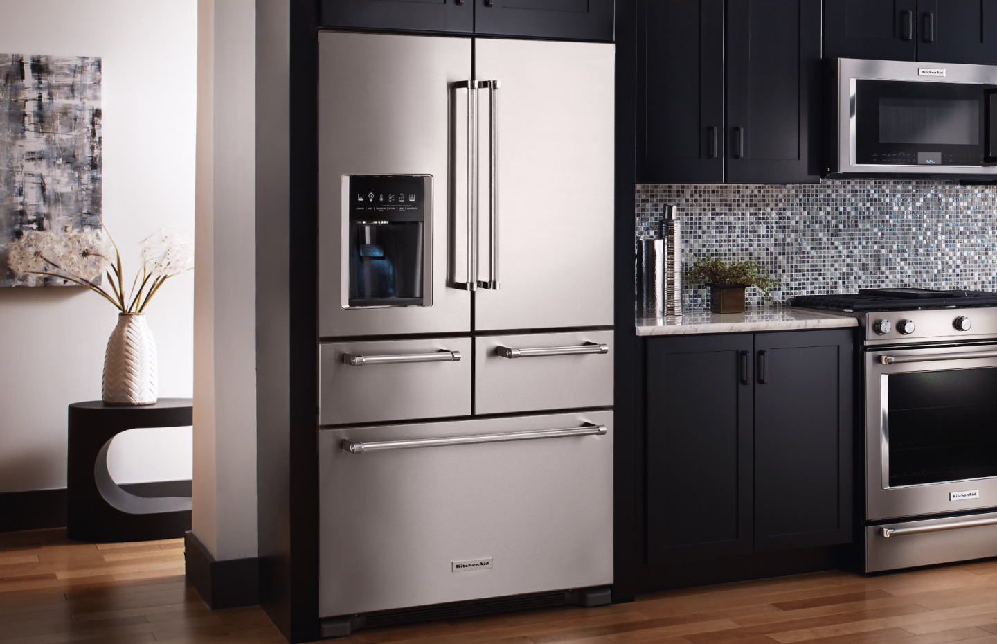 A multi-door KitchenAid® refrigerator in a modern kitchen. A multi-door KitchenAid® refrigerator in a modern kitchen.